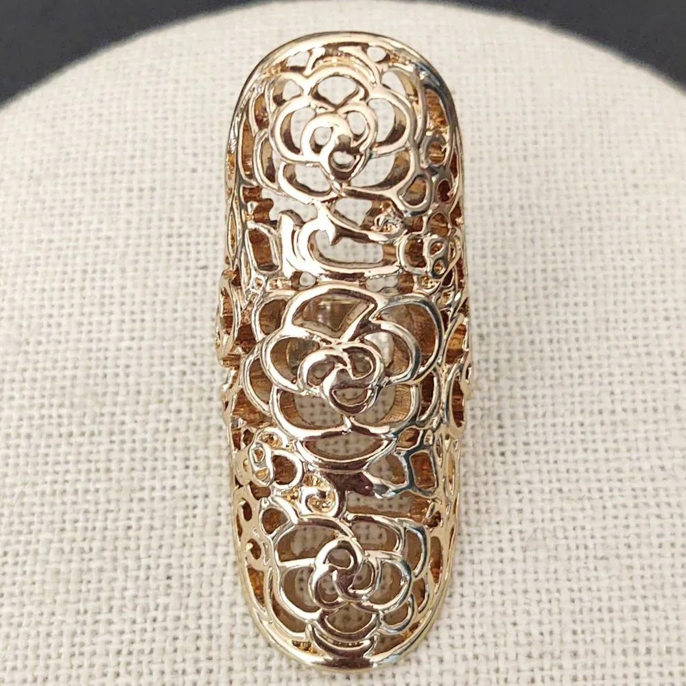 Long, open scroll design gold ring
